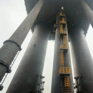 Steel Ladder with Safety Cage | Xiaofan Safety 13 Yellow steel ladder with safety cage installed in industrial refinery site