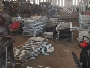 Steel Ladder with Safety Cage | Xiaofan Safety 16 Steel ladder components prepared in factory workshop