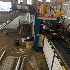 Steel ladder cutting and fabrication in factory workshop